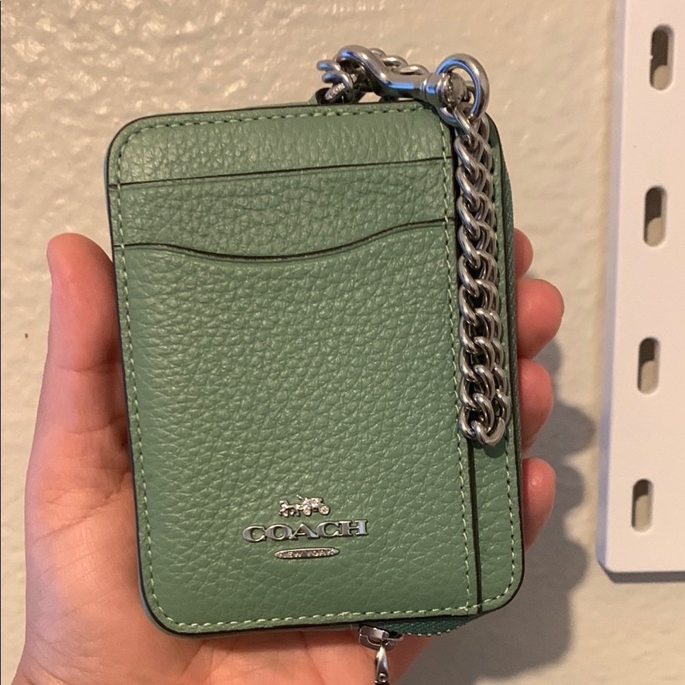 Coach zip card case in the mint green with silver hardware
